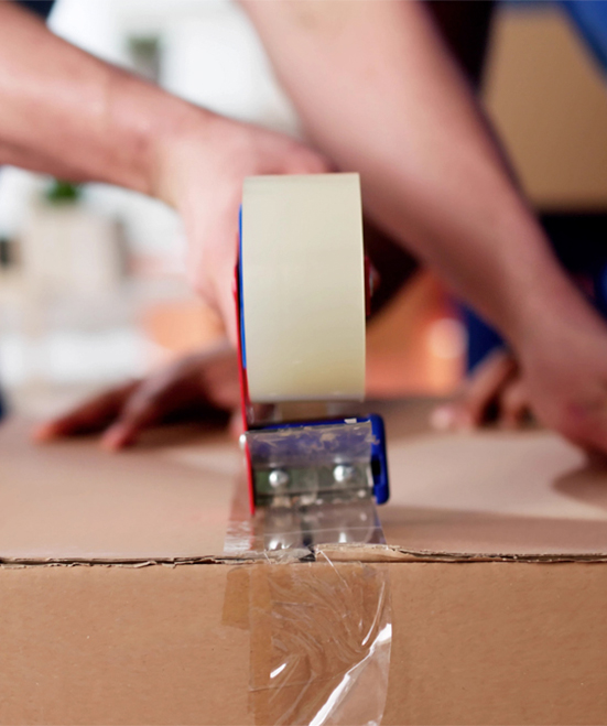 Person taping up a package.