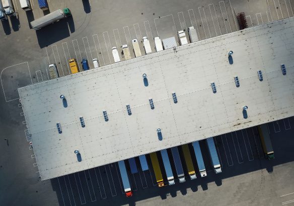 overnight-truck-storage Ariel view of trucks loading at logistic center.