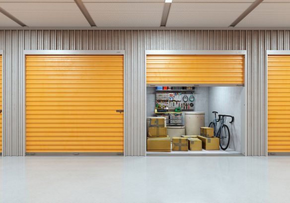 Self-Storage Facility Interior with Tools An organized self-storage facility featuring orange storage doors.